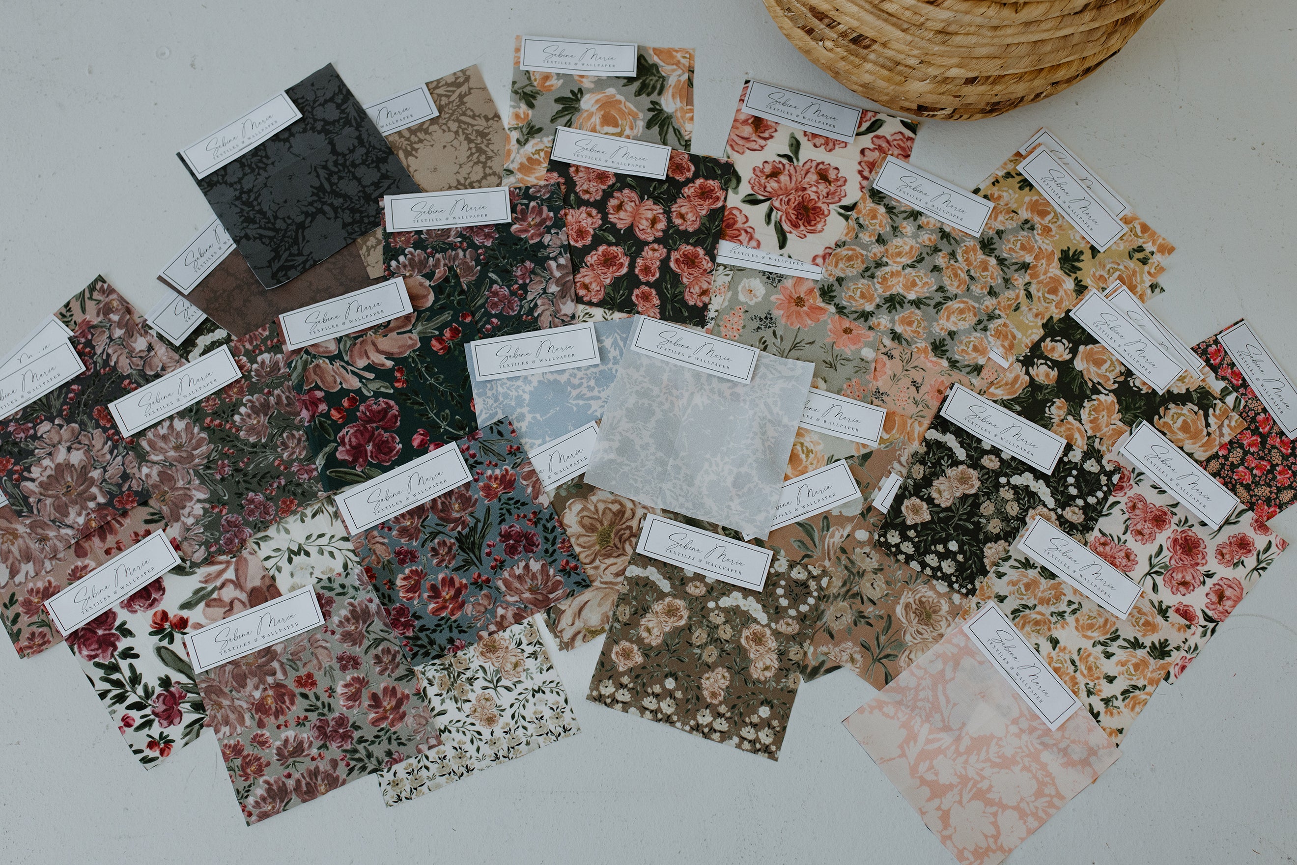Collection of fabric swatches with floral patterns by Sabina Maria Design