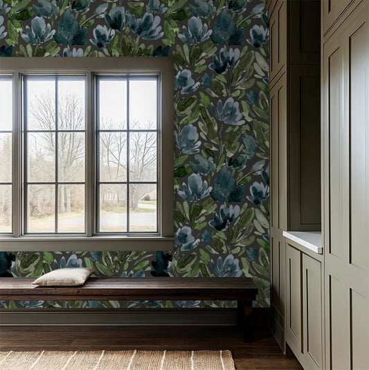 Floral wallpaper with green and blue botanical pattern in a cozy room setting.