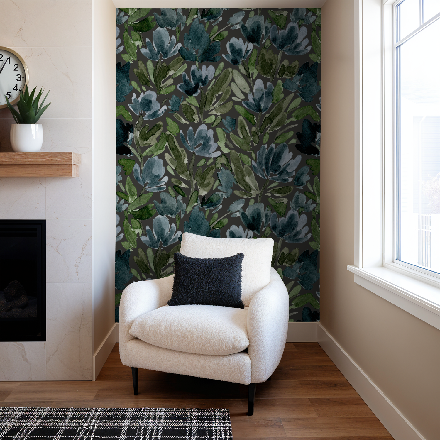 White armchair with a dark pillow against a floral wall in a living room.