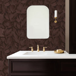 Burgundy brown floral wallpaper in elegant bathroom setting with mirror.