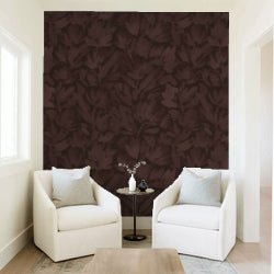Burgundy brown floral wallpaper in elegant living room with white chairs.