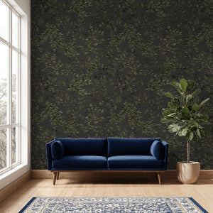 Charcoal wallpaper with watercolor leaf branches in modern living room, blue sofa.
