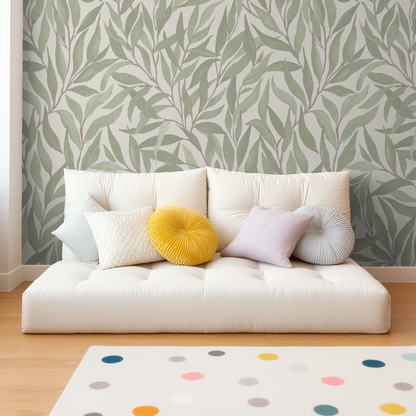 Green leaf pattern wallpaper in modern living room with white sofa and colorful cushions.