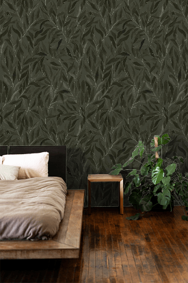 Bedroom with dark leaf-patterned wallpaper, wooden floor, and plant.