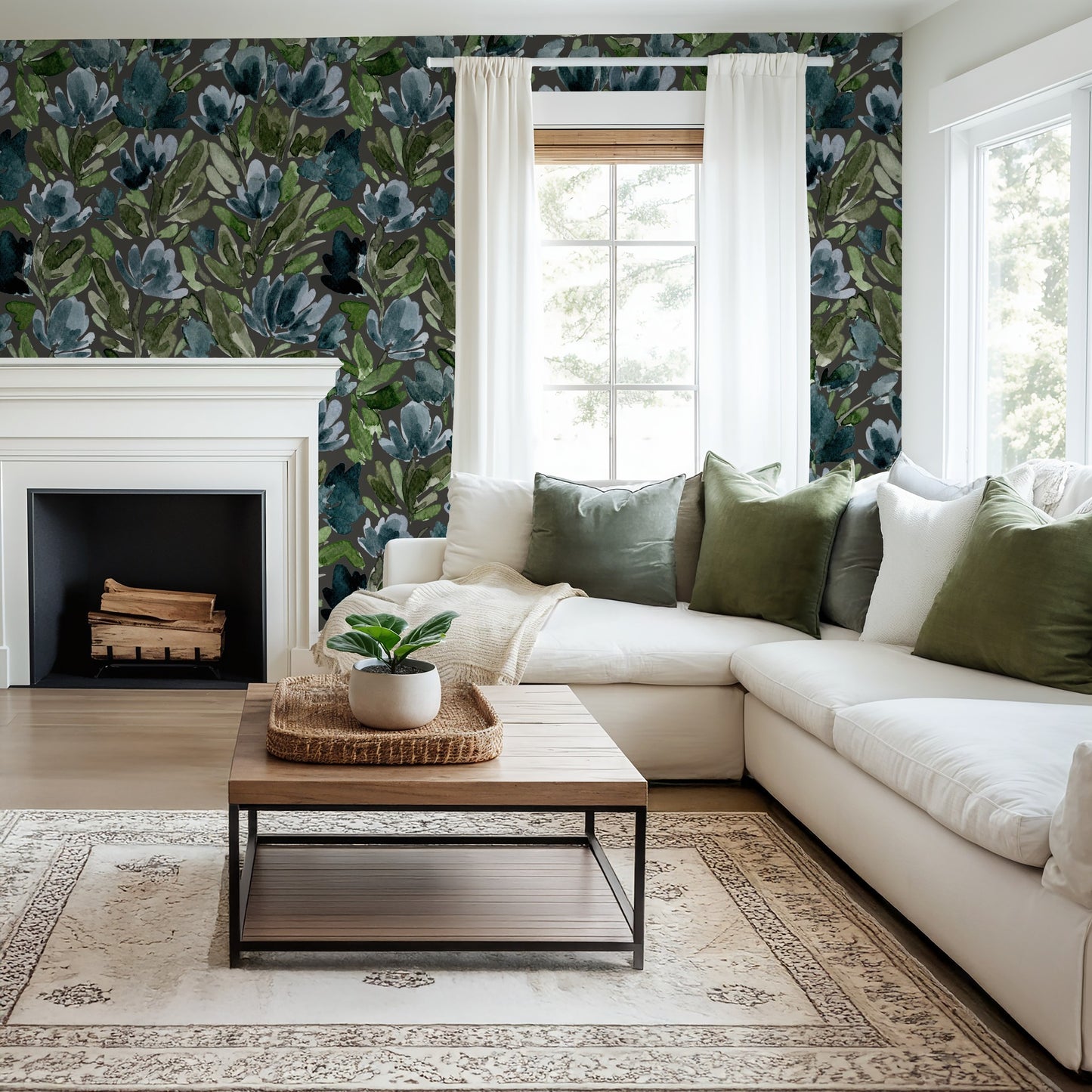 Living room with Midnight Tulip Vines charcoal floral wallpaper, white sofa, and green pillows.