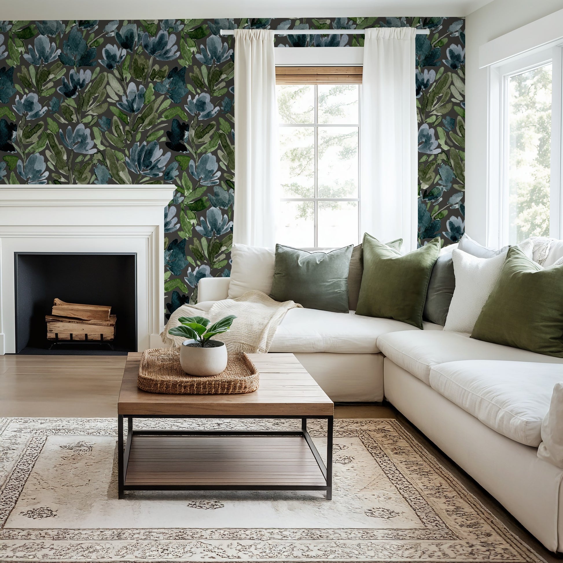 Living room with Midnight Tulip Vines charcoal floral wallpaper, white sofa, and green pillows.