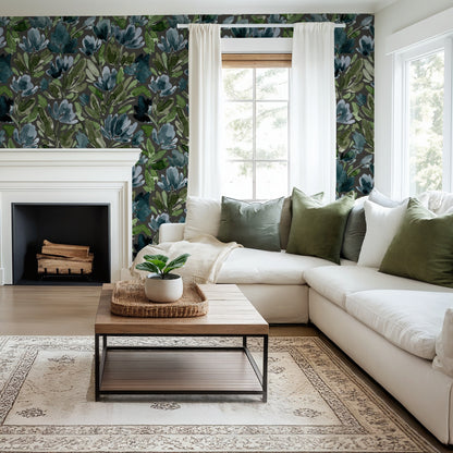 Living room with Midnight Tulip Vines charcoal floral wallpaper, white sofa, and green pillows.