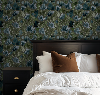 Olive green floral wallpaper with tulip vines in a cozy bedroom setting.