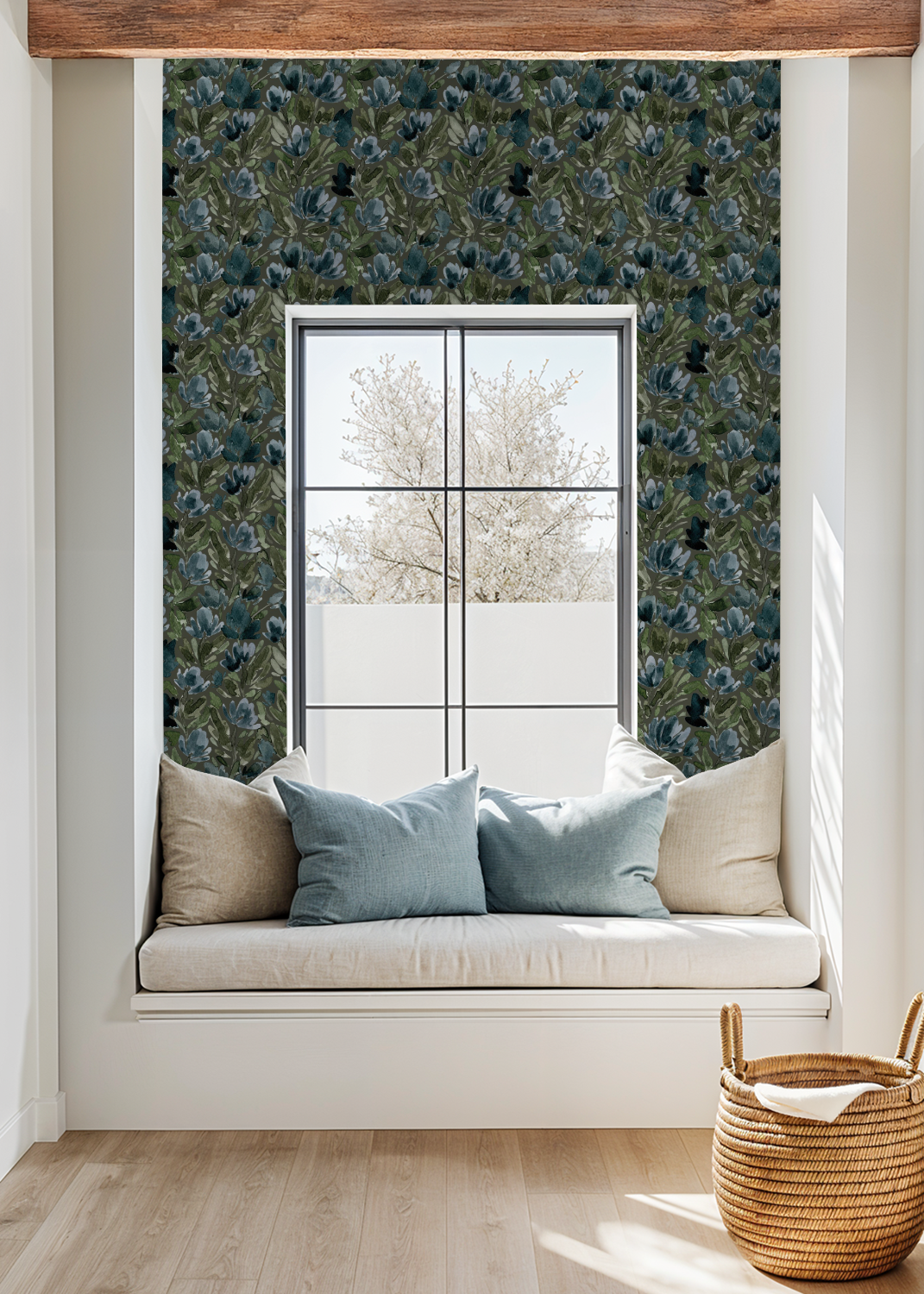 Olive green floral wallpaper in cozy window nook with cushions and basket.